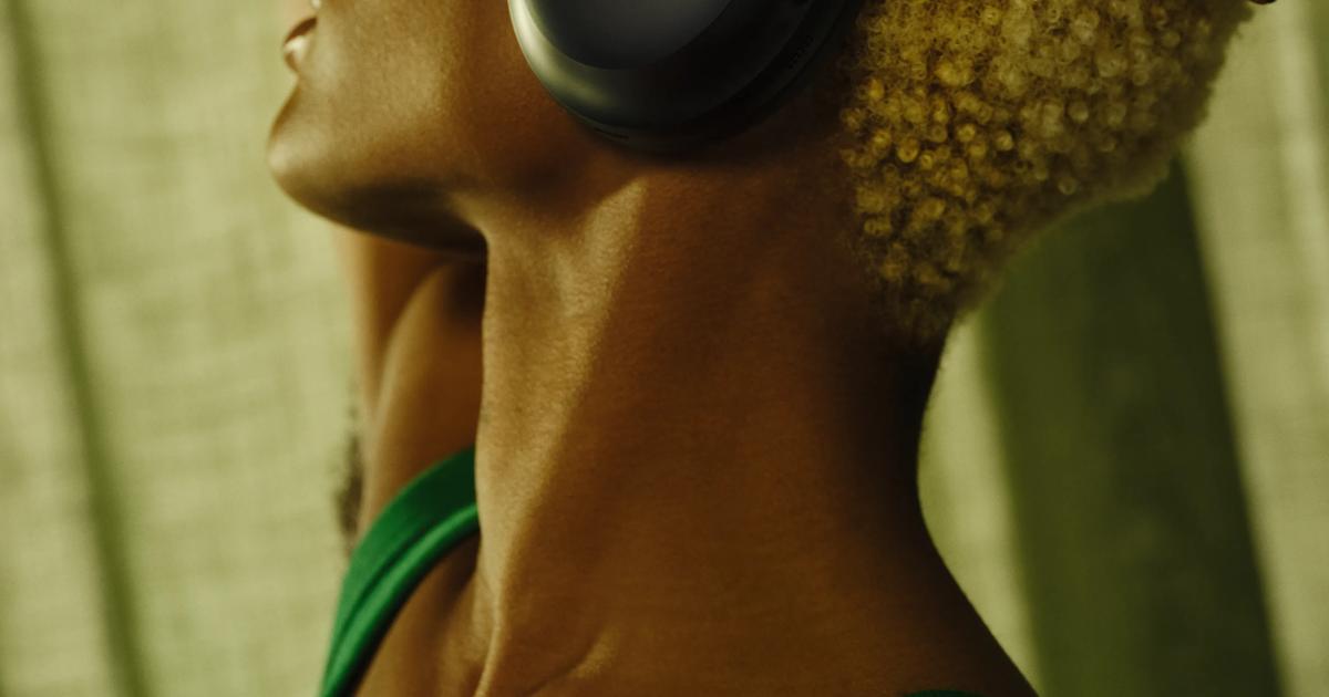 Bose lifestyle photography of the original QuietComfort Ultra Headphones.