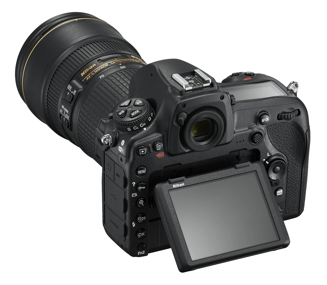 The tilting rear display supports low-angle composition; the pictured lens is optional.